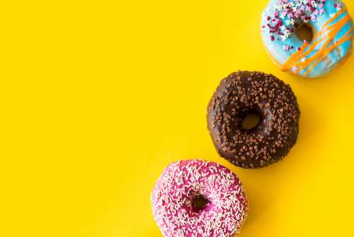 Yummy Donuts on Yellow Background