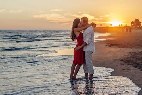 A Couple Of Young Couple Love Kiss Kissing Sunset