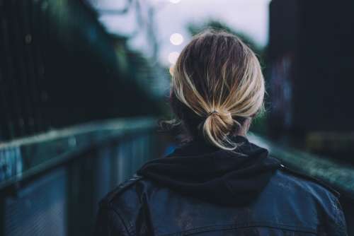 Adult Back View Black Leather Jacket Blonde Hair