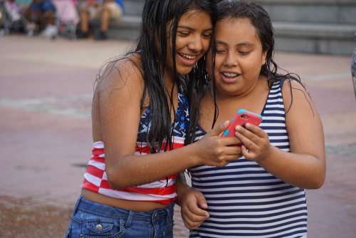 Cell Phone Spanish Playful Happy Girls