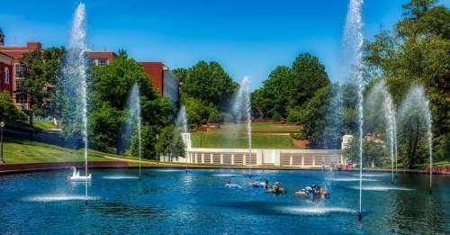 Clemson University Pond Fountain Students Swimming