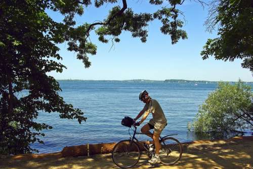 Cyclist On Lakeshore Path Bicycle Trail Cycling