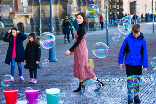 Happy Young Soap Bubbles Tourism