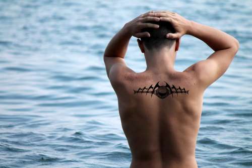 Man Move Tattoo Distant Water Sea
