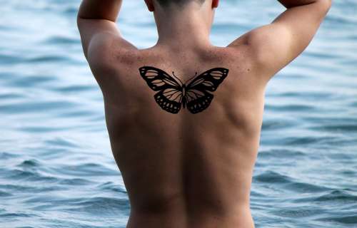 Man Move Tattoo Butterfly Distant Water Sea