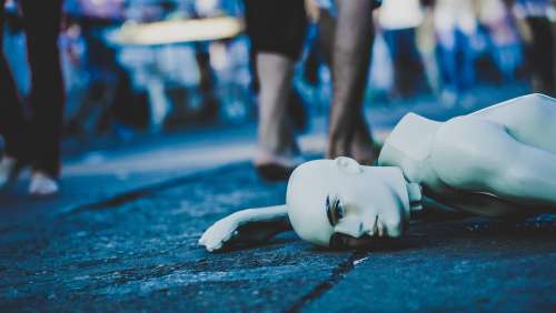 Mannequin Lying Down Street Dead Ignoring Uncaring
