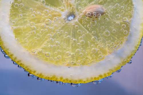 Slice Of Lemon Lemon Small Bubbles In The Water Wet