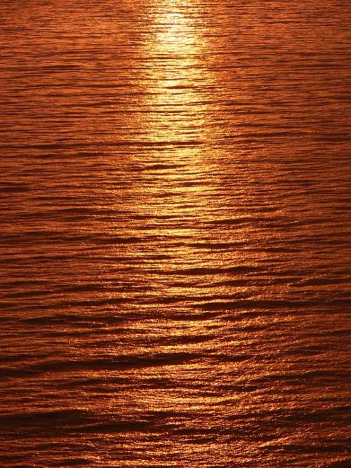 Streak Light Sunset Reflected Calm Sea Sea