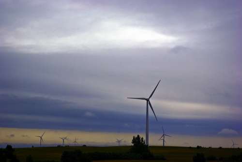 Wind Turbines Against Dark Clouds Wind Power Clouds