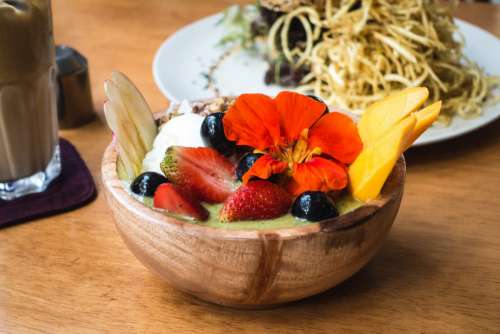Colorful healthy smoothie bowl with fruits