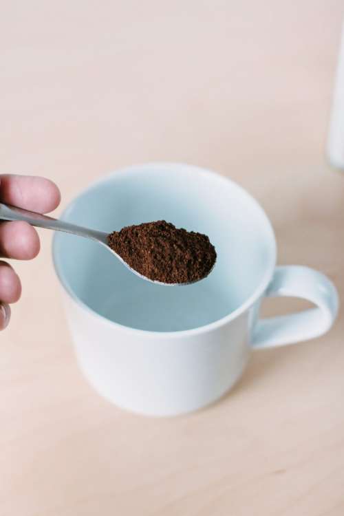 Ground coffee in a spoon 2