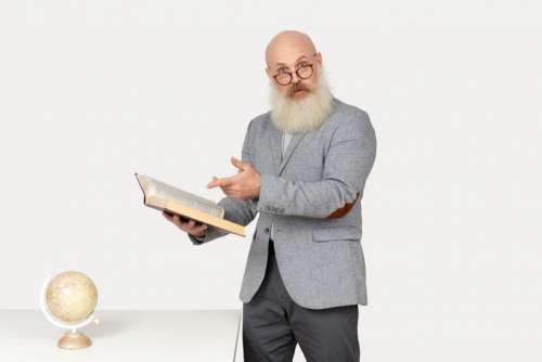 Surprised Looking Old Professor Holding A Book