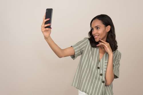 Young Pretty Girl Making A Selfie