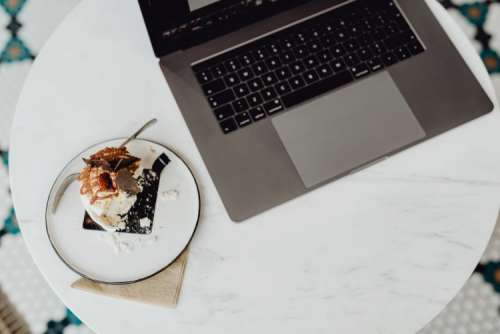 Coffee and cake with meringue in a patisserie