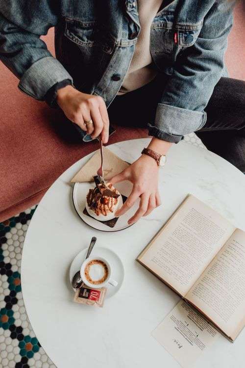 Coffee and cake with meringue in a patisserie