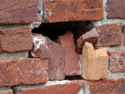 brick wall hole damaged broken