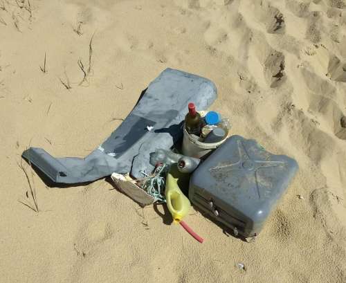 beach.sand junk flotsam jetsam pollution