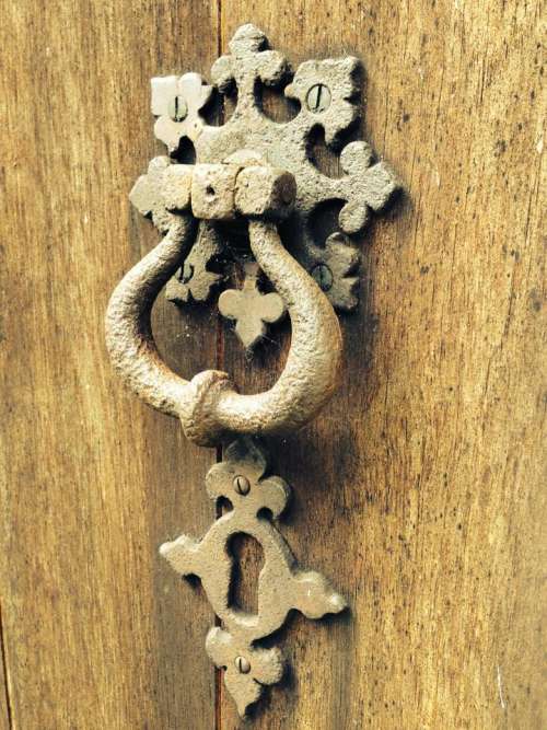 door knocker brass old cobwebs wood