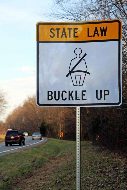 sign state law buckle up seat belt warning
