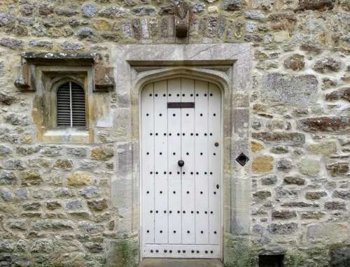 white door stone walk entrance historic wooden door