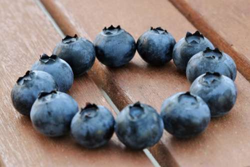 blueberries blue berries wood circle