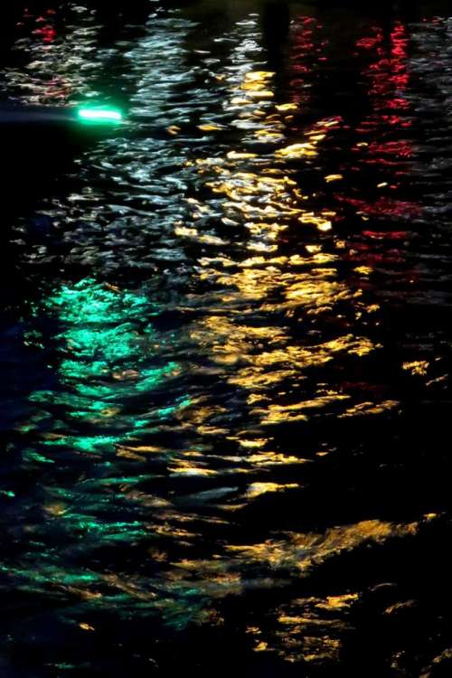 water reflection night lights green