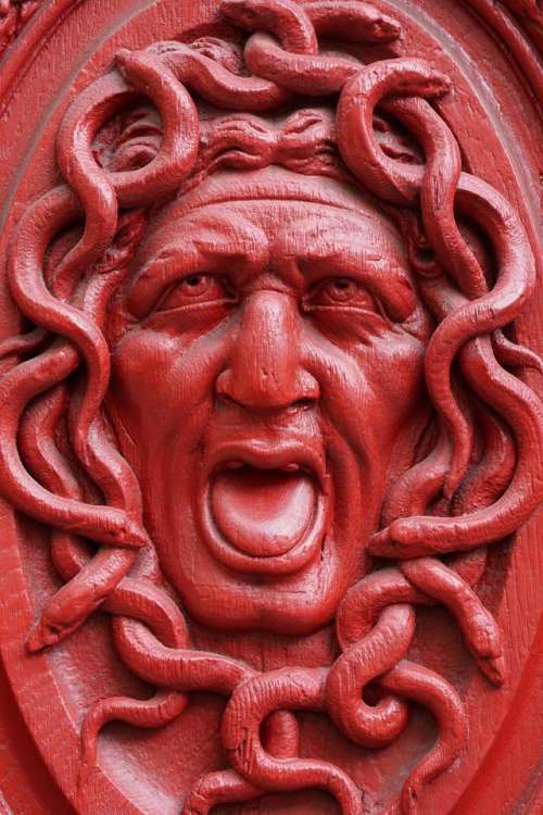 relief art red Medusa Gorgon