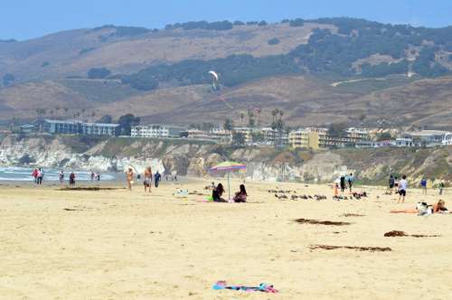 Pismo Beach California sand kite sun bathing sunbathe