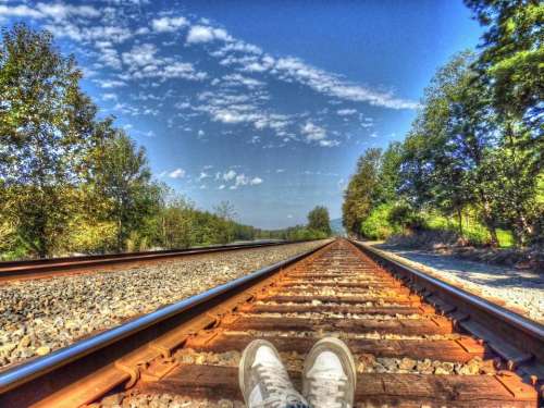 Feet perspective train tracks rails