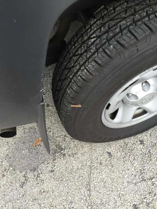 tire flat tire nail in tire  
