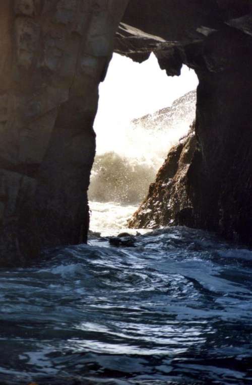 sea cave cave arch opening water