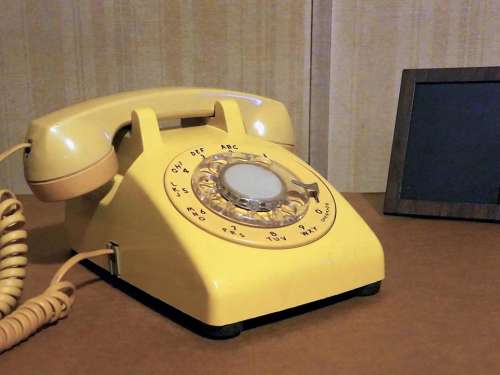 telephone phone landline rotary phone yellow