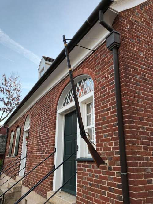 rifle gutter brick house