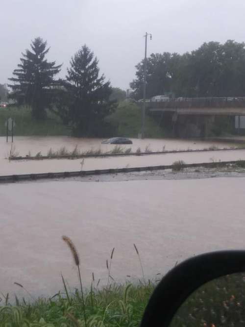 car car in water water flood highway