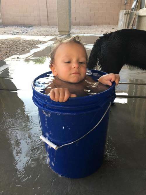 bucket boy toddler swim backyard