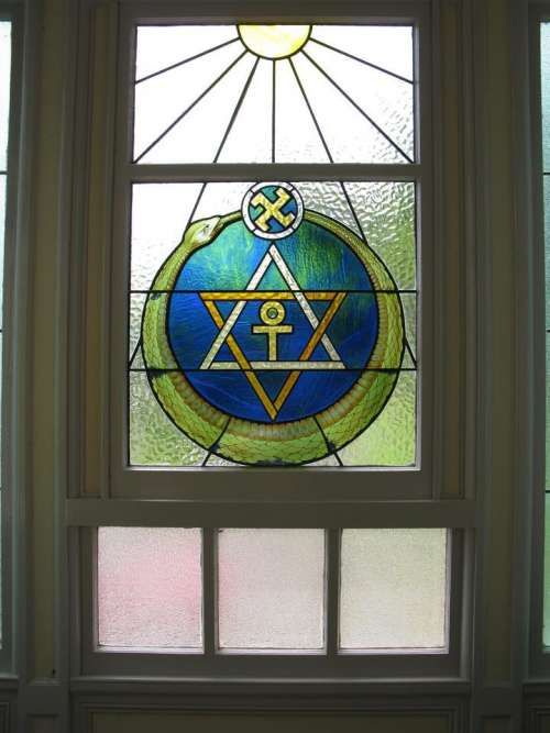 Window ornate stained glass Theosophical logo