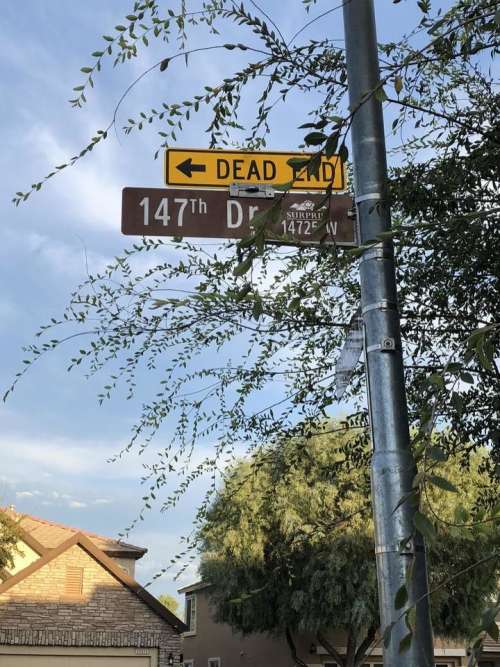 street sign dead end street street pole pole