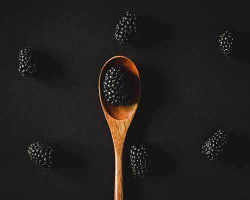 Blackberries on a wooden spoon