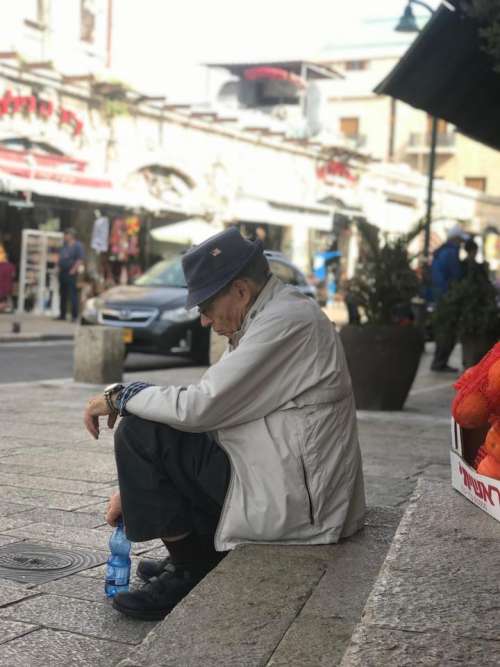 street city people senior citizen sitting