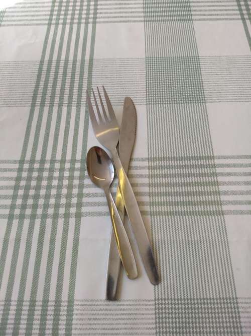 knives forks cutlery tablecloth cafe