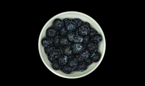 Blueberry Bowl Against Black Photo