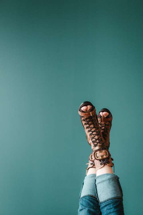 Open Toe Boots Against A Blue Background Photo