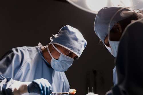Surgeon Concentrates on Work Photo