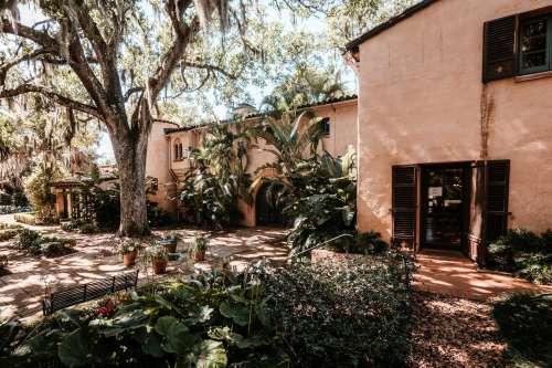 Terracotta House With Lush Backyard Photo