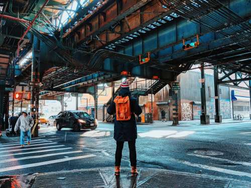 Traveller In NYC with Backpack Under Bridge Photo