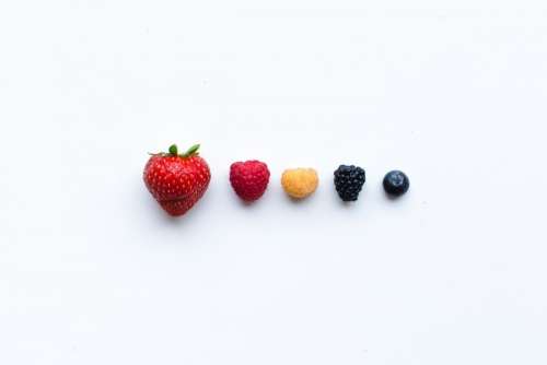 Colorful fresh berries on a white background