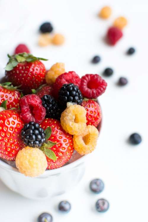 Colorful healthy fresh berries in a cup