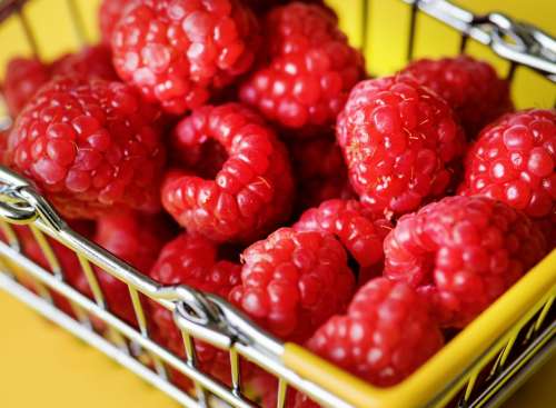 Fresh raspberries in a mini basket