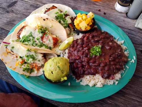 fish tacos quacamole mango salsa black beans and rice meal