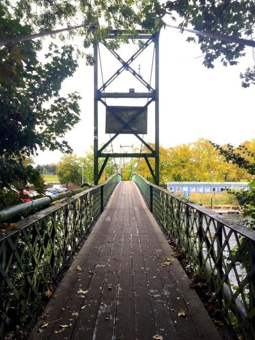 footbridge bridge river England trees